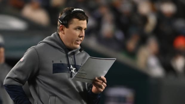 Jan 8, 2022; Philadelphia, Pennsylvania, USA; Dallas Cowboys offensive coordinator Kellen Moore stands on the sidelines against the Philadelphia Eagles during the second quarter at Lincoln Financial Field. Mandatory Credit: Tommy Gilligan-USA TODAY Sports
